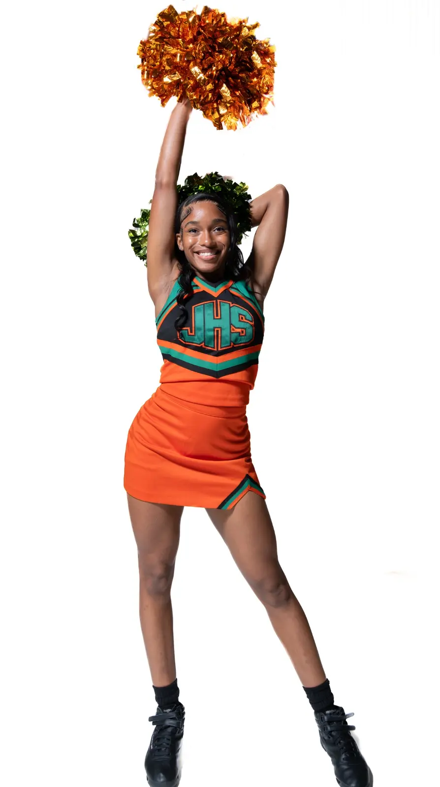 Jones High cheerleader posing with pom-poms during Media Day